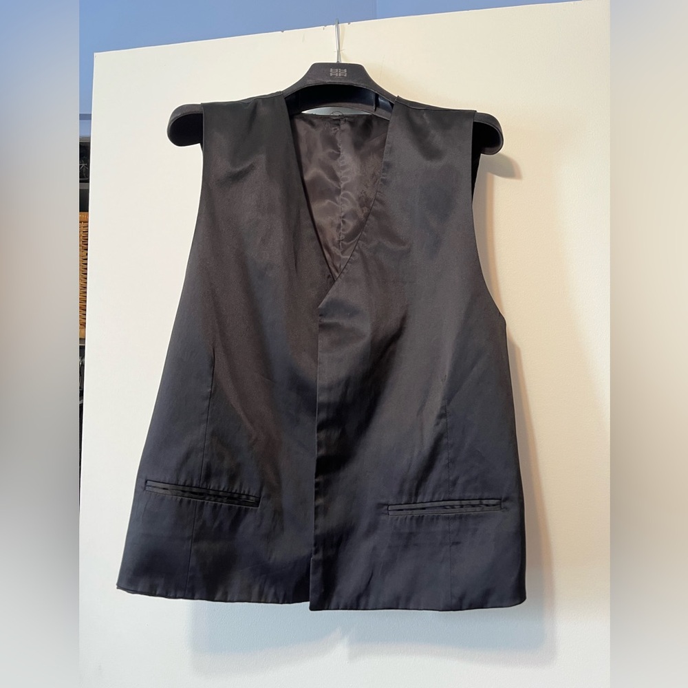 Men’s sleek black vest with buttons